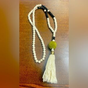Bali cream-black beaded necklace with tassel and pom pom